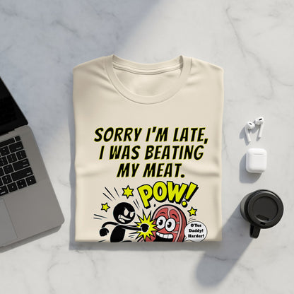 Cream t-shirt with "Sorry I'm late, I was beating my meat" graphic.