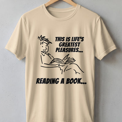 Cream t-shirt with line drawing of person reading and text "This is life's greatest pleasures... reading a book...".