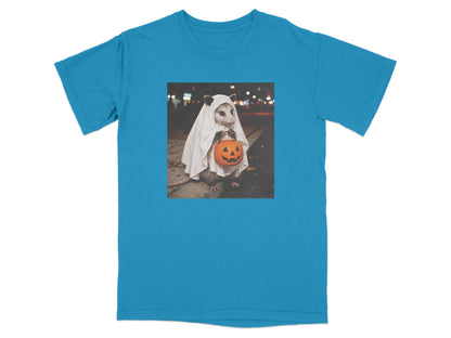 Opossum in ghost costume holding carved pumpkin on t-shirt.