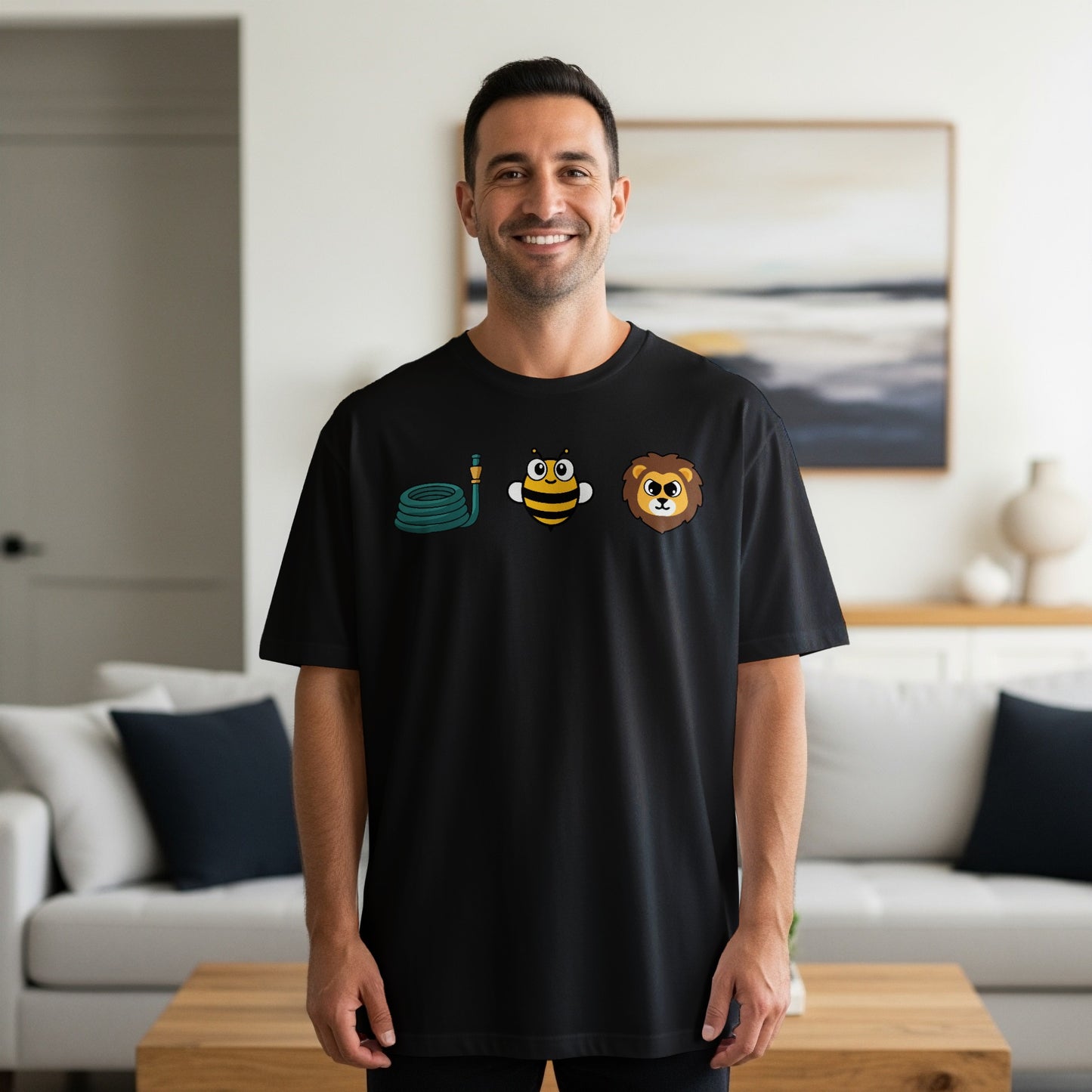 Black t-shirt with a coiled hose, cartoon bee, and lion graphic.