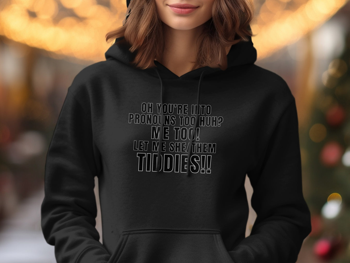 Black hoodie with text: Oh you're into pronouns too huh? Me too! Let me she/them tiddies!!