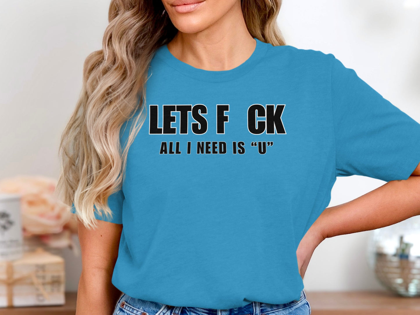 Blue t-shirt with black text "LETS F CK ALL I NEED IS 'U'".