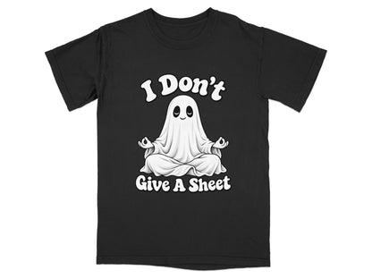 Black t-shirt with a white ghost meditating and text that says "I Don't Give A Sheet".