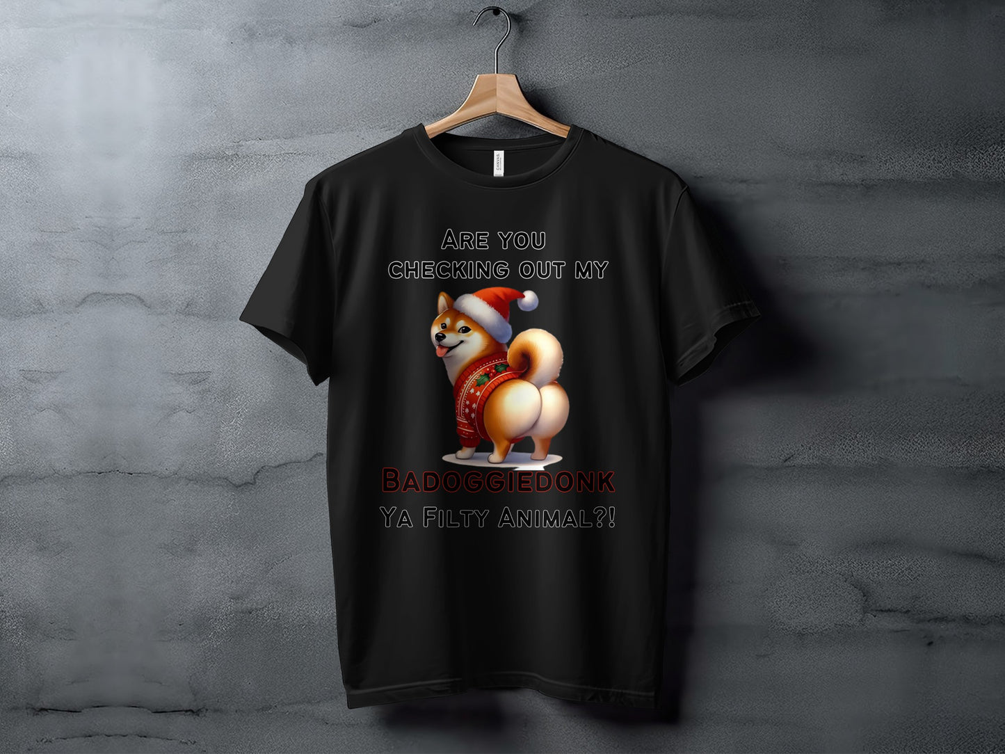 Black t-shirt with a Shiba Inu wearing a Santa hat and a festive sweater. Text reads "Are you checking out my BADOGGIEDONK YA FILTY ANIMAL?!".