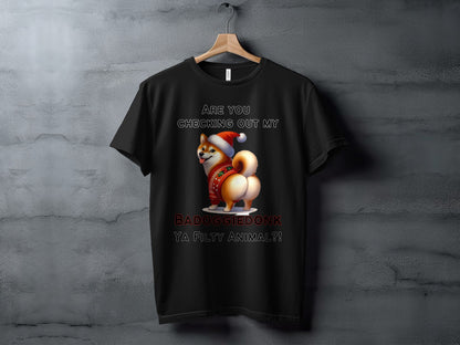 Black t-shirt with a Shiba Inu wearing a Santa hat and a festive sweater. Text reads "Are you checking out my BADOGGIEDONK YA FILTY ANIMAL?!".