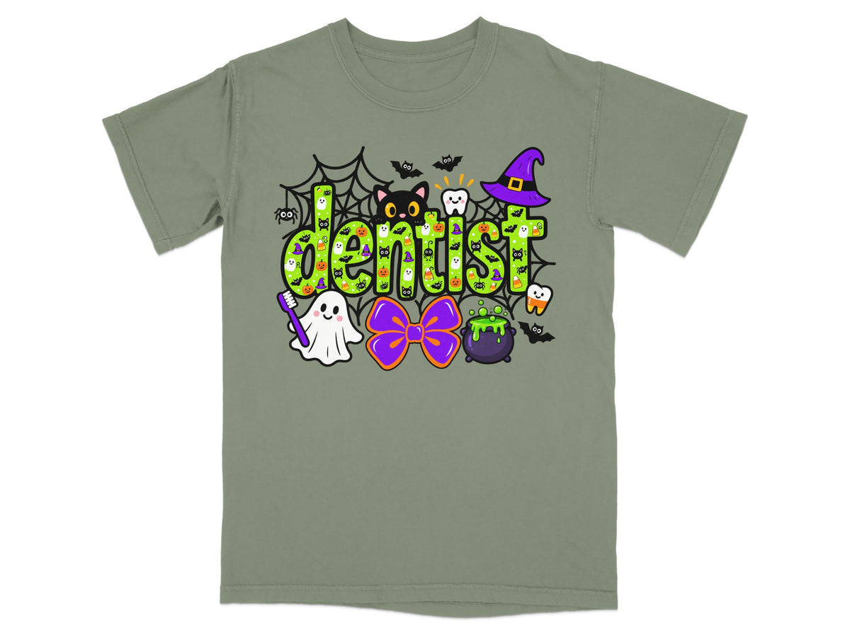 An olive green t-shirt featuring a playful Halloween-themed dentist graphic with ghosts, cats, and spiderwebs.