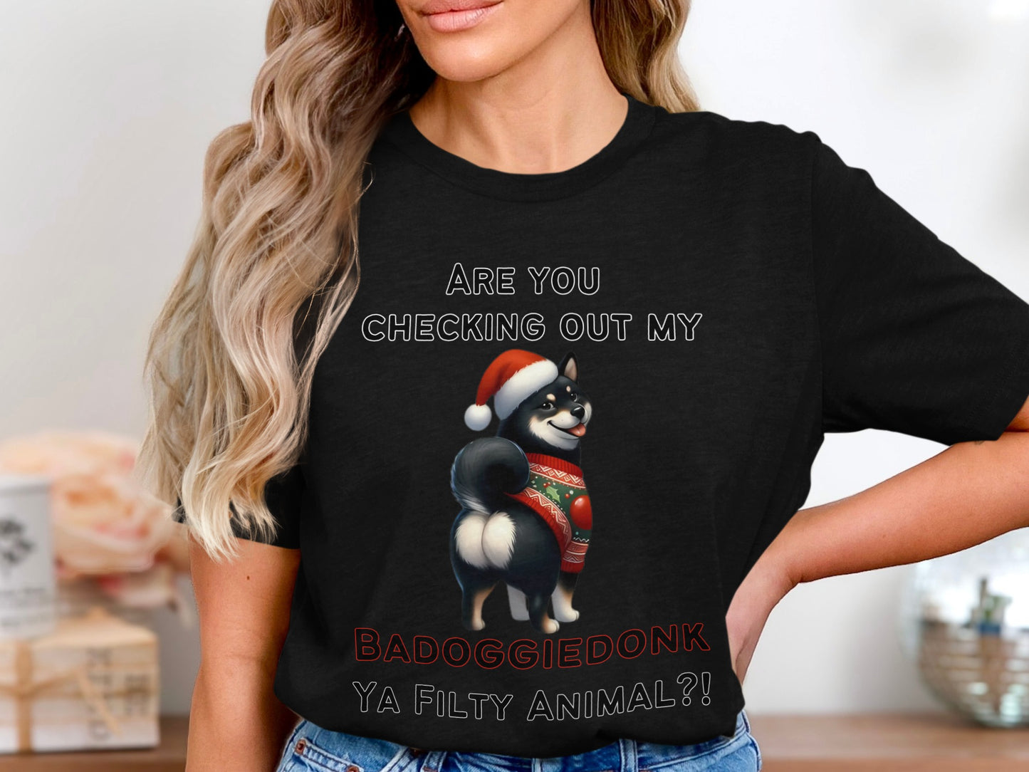 Black t-shirt with a Shiba Inu wearing a Santa hat and sweater, and text.