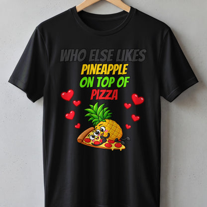 Black t-shirt with cartoon pineapple on pizza and hearts, text "Who else likes pineapple on top of pizza".
