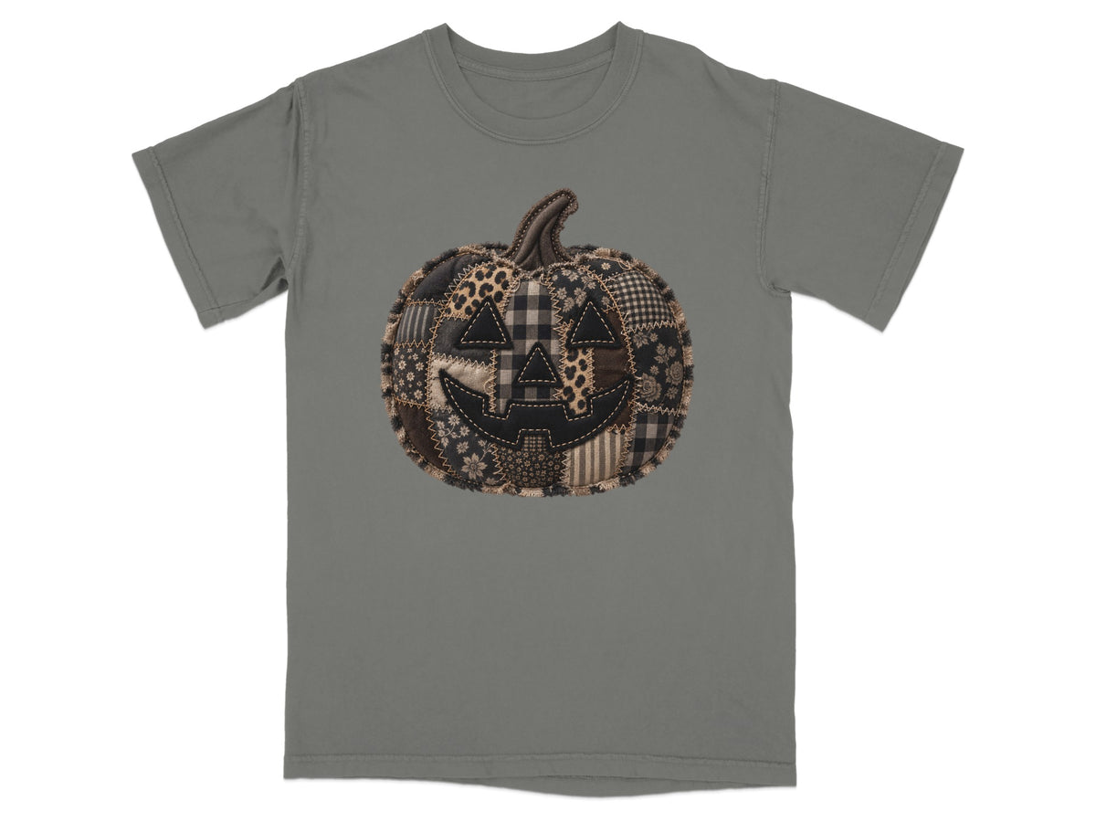 Gray t-shirt with a patchwork jack-o'-lantern graphic on the front.
