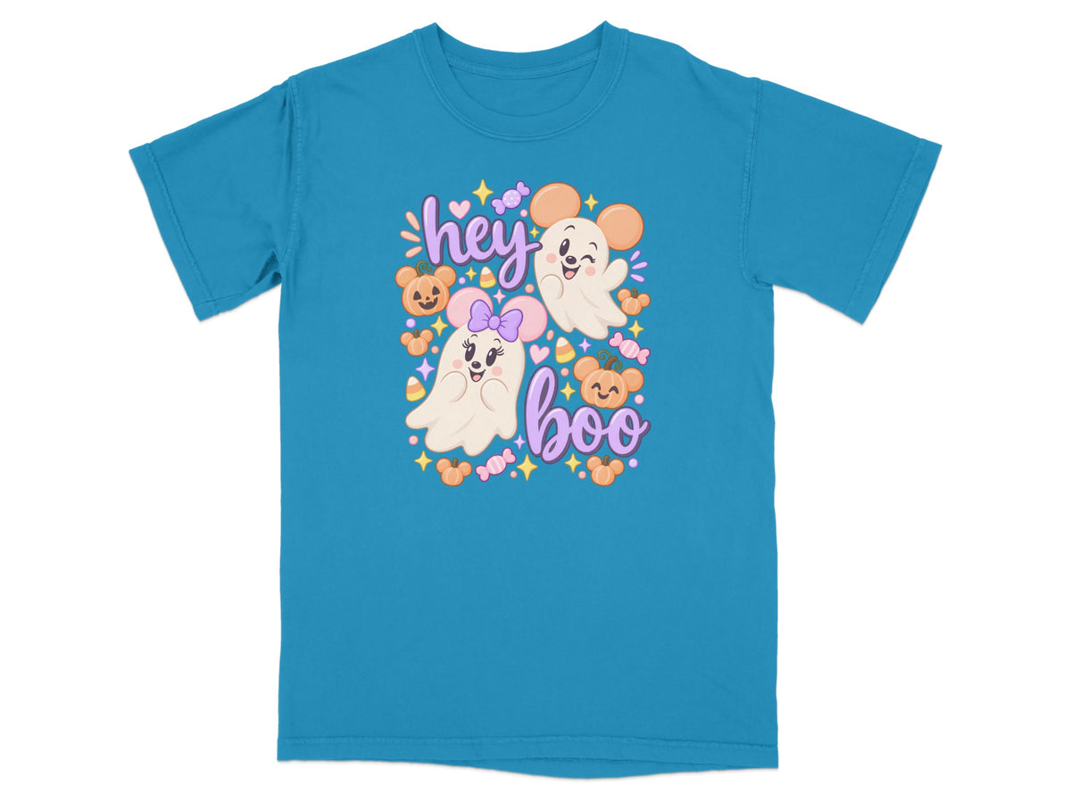 Cute ghost characters with mouse ears on a teal t-shirt with "hey boo" text.