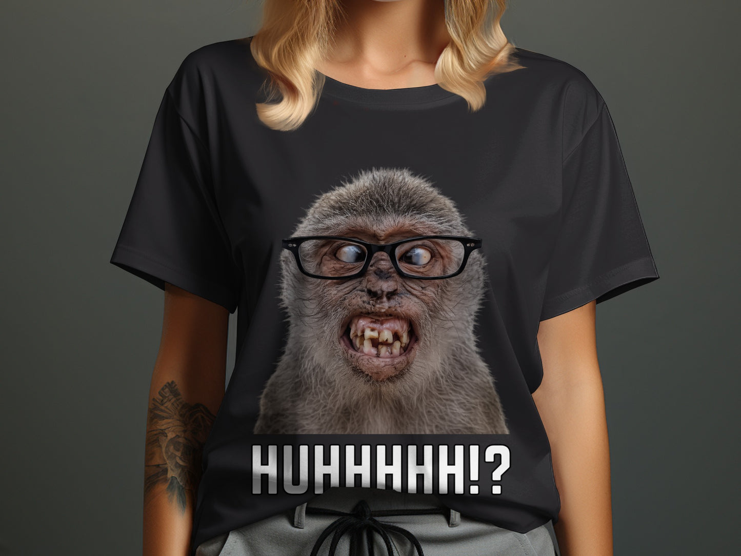 Black t-shirt with a close-up of a monkey wearing glasses and text "HUHHHHH!?".
