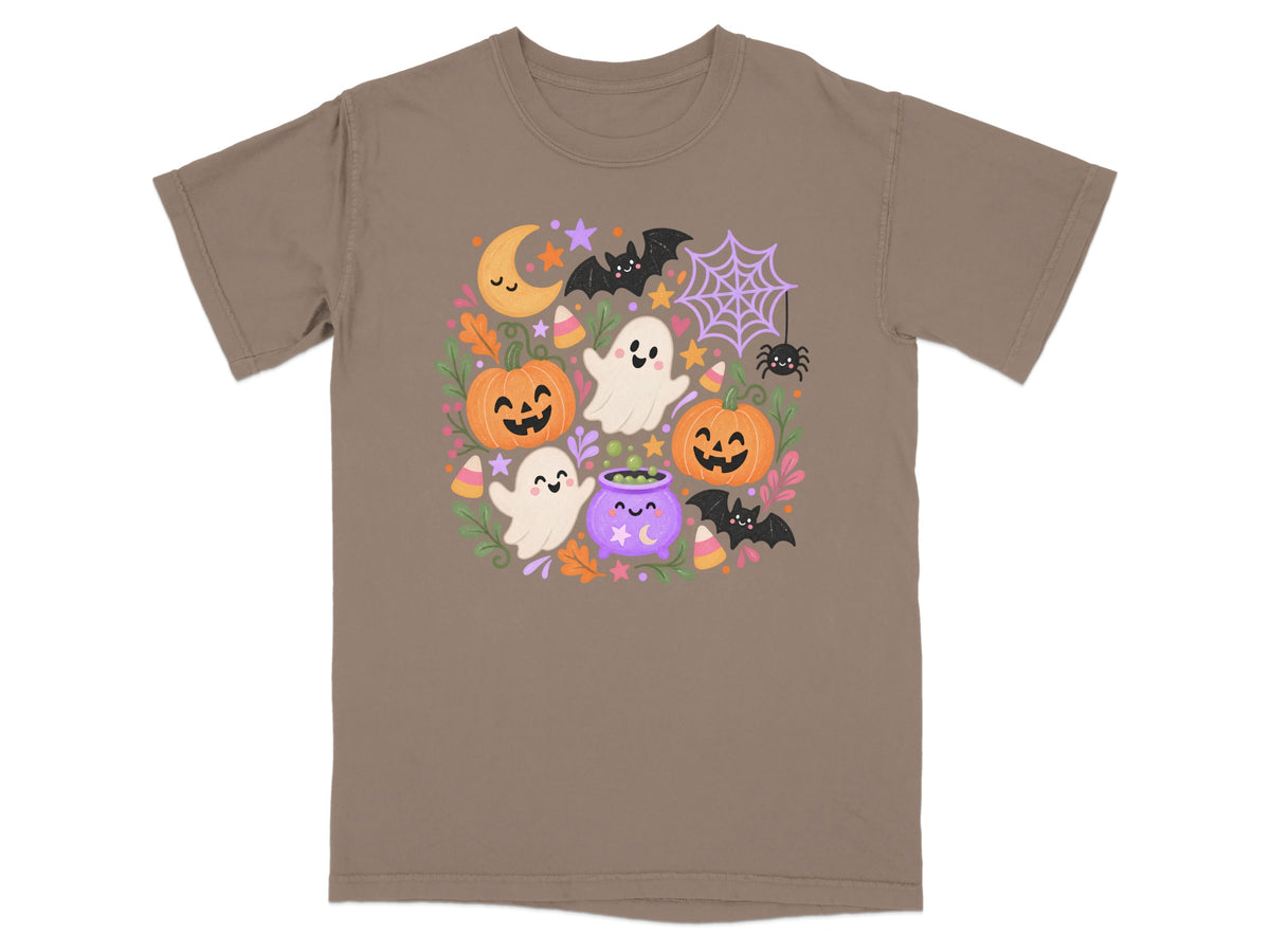 Halloween graphic with pumpkins, ghosts, bats, moon, and candy corn on a t-shirt.