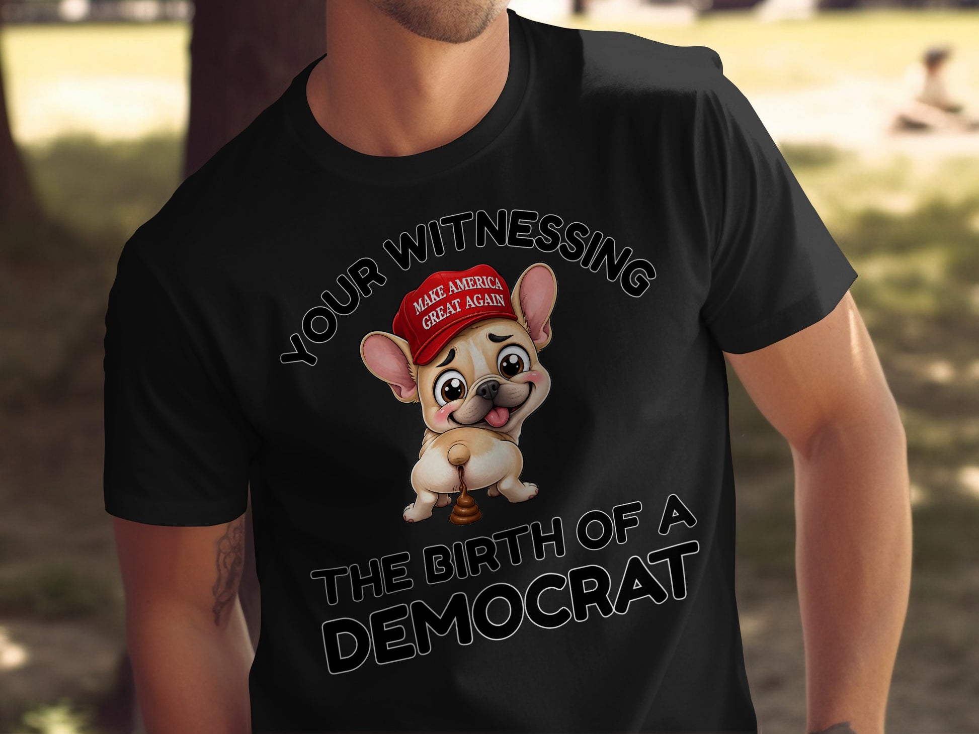 French Bulldog wearing MAGA hat with "The Birth of a Democrat" text.