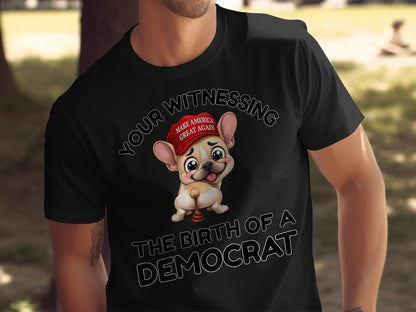 French Bulldog wearing MAGA hat with "The Birth of a Democrat" text.
