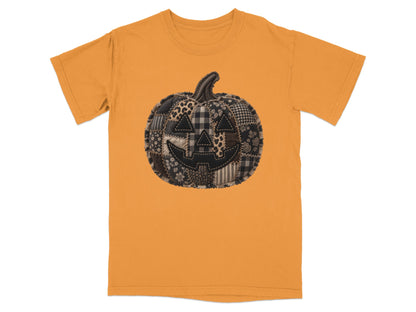 Orange t-shirt with a quilted patchwork jack-o'-lantern graphic.