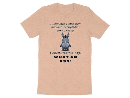 Peach t-shirt with cartoon donkey and text "I MUST HAVE A NICE BUTT BECAUSE EVERYTIME I TURN AROUND I HEAR PEOPLE SAY: WHAT AN ASS!"