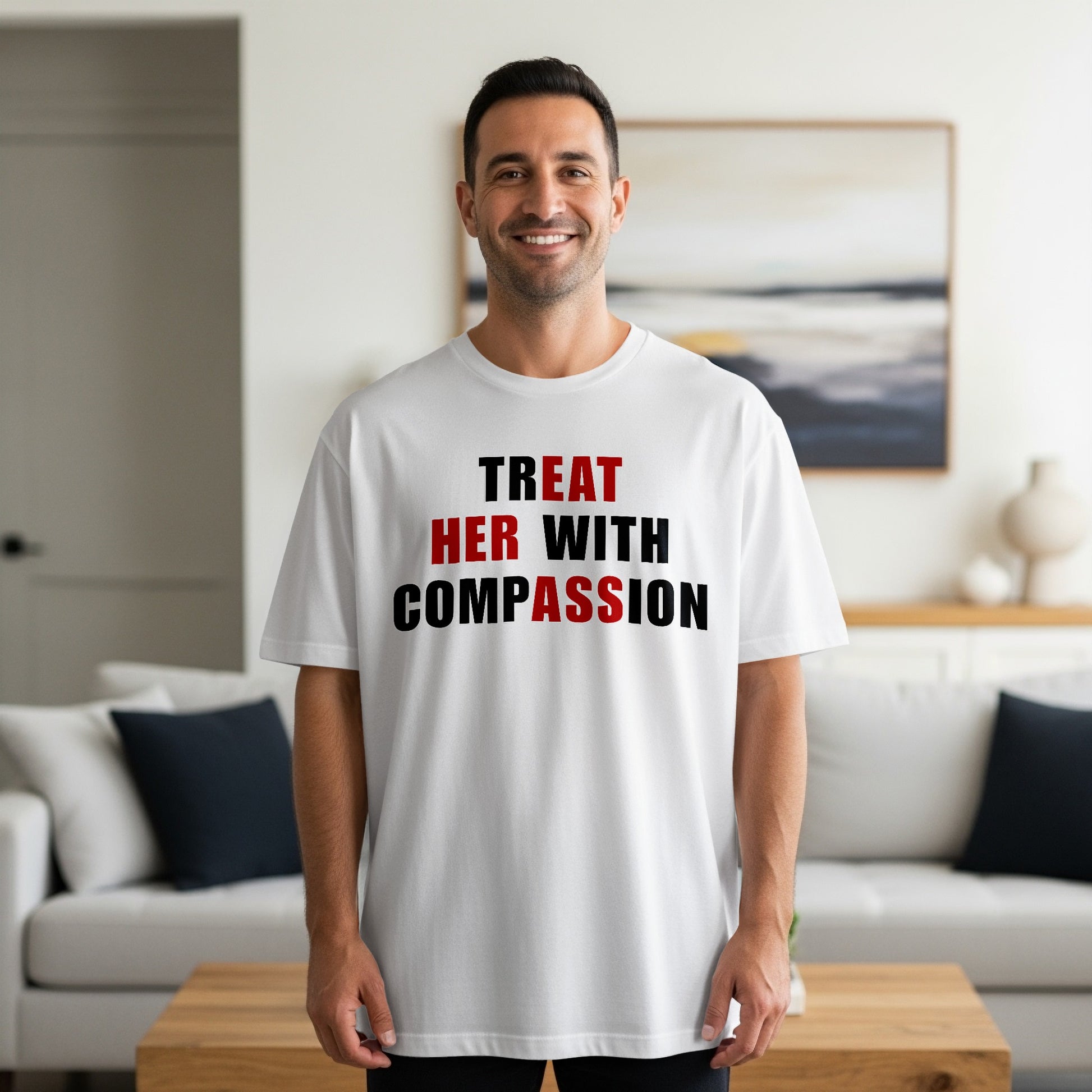 White t-shirt with text "TREAT HER WITH COMPASSION" in black and red.