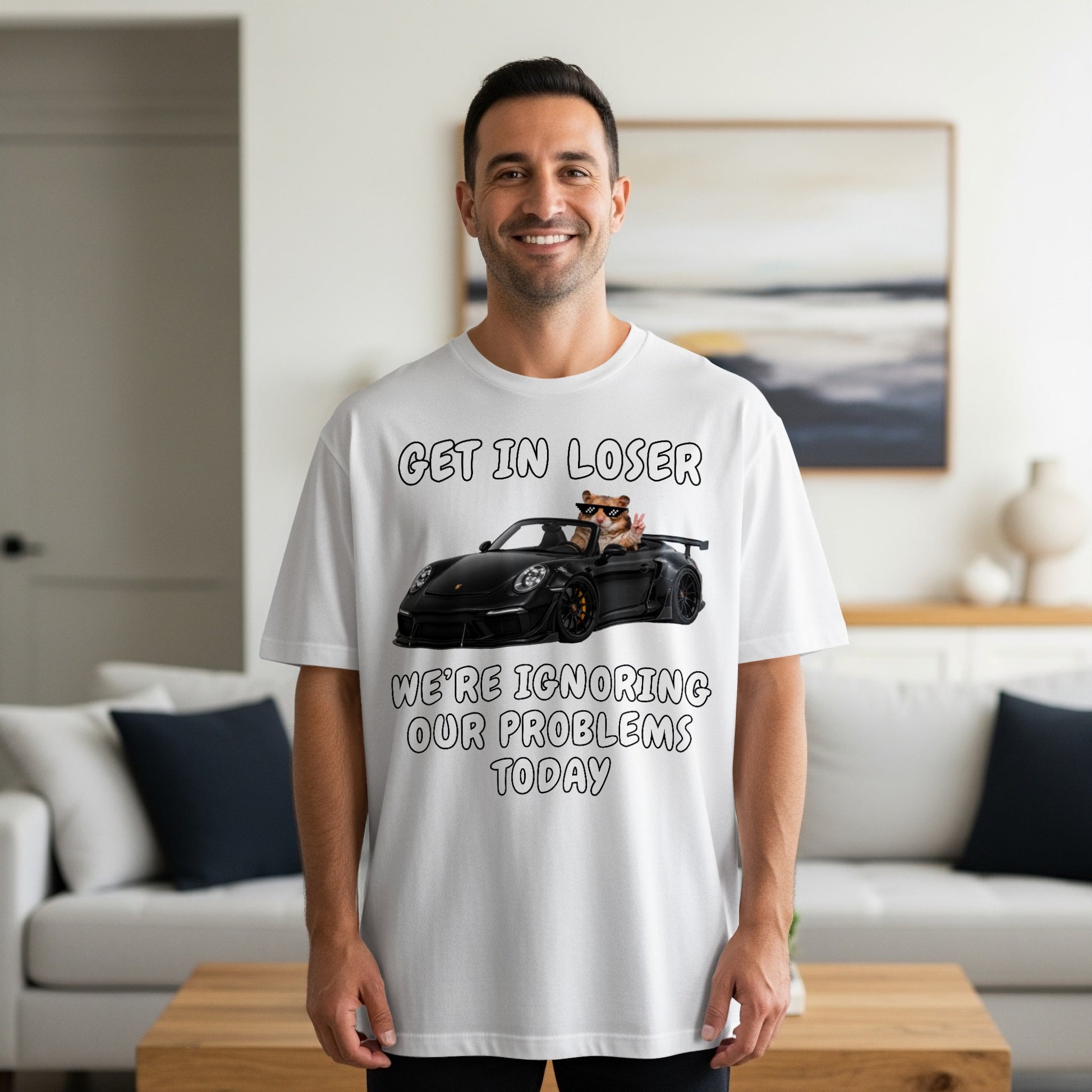 White t-shirt graphic with text and hamster driving a car.