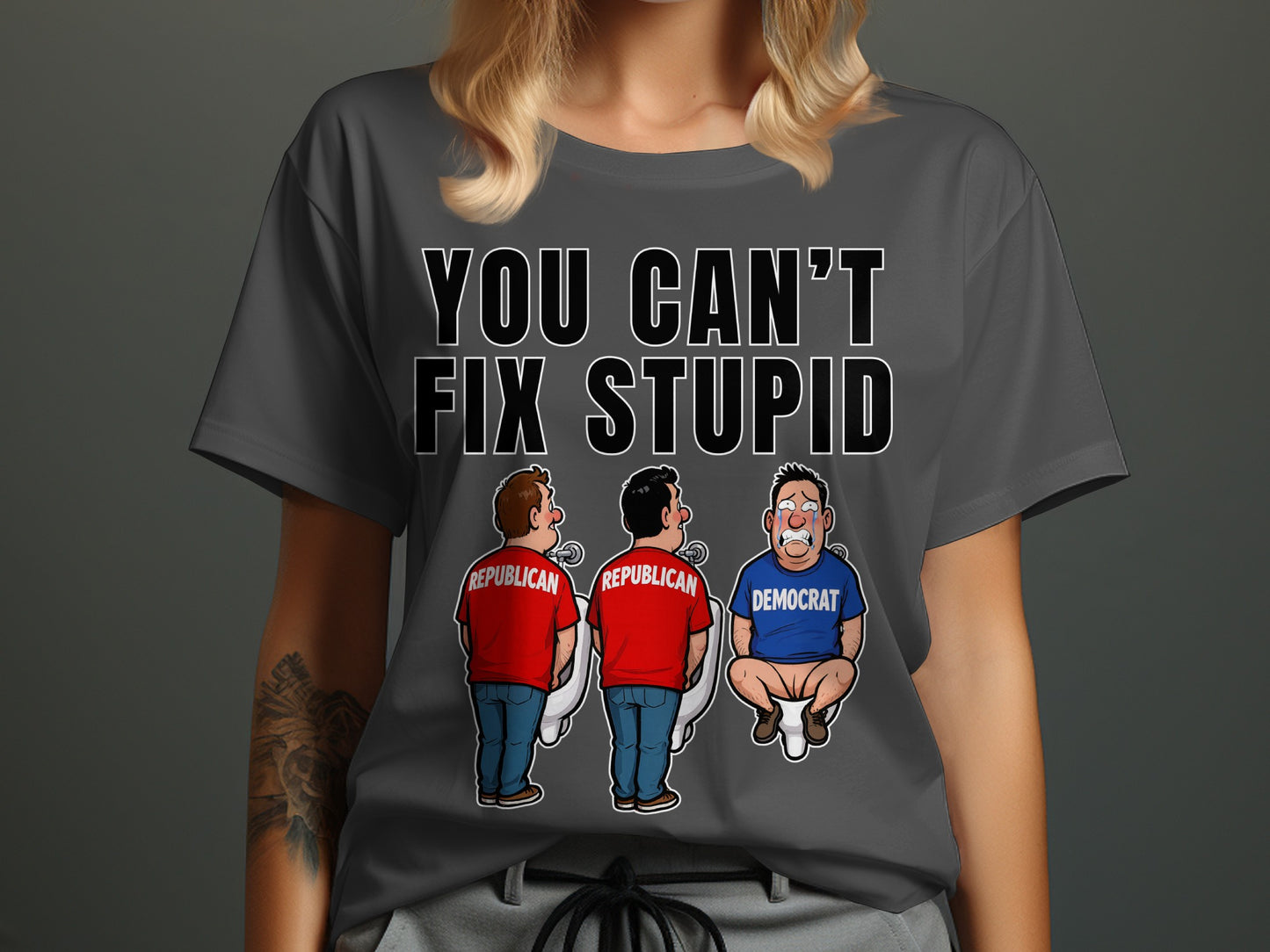 T-shirt with text "YOU CAN'T FIX STUPID" and cartoon of two Republicans at urinals and one crying Democrat on toilet.