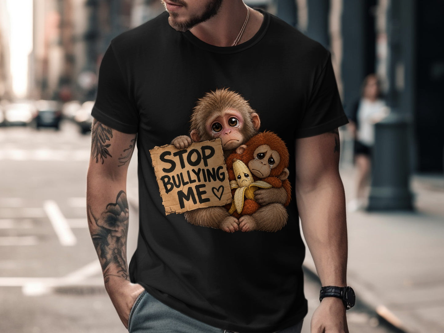 T-shirt graphic of two sad monkeys holding a banana and a sign that says "STOP BULLYING ME".