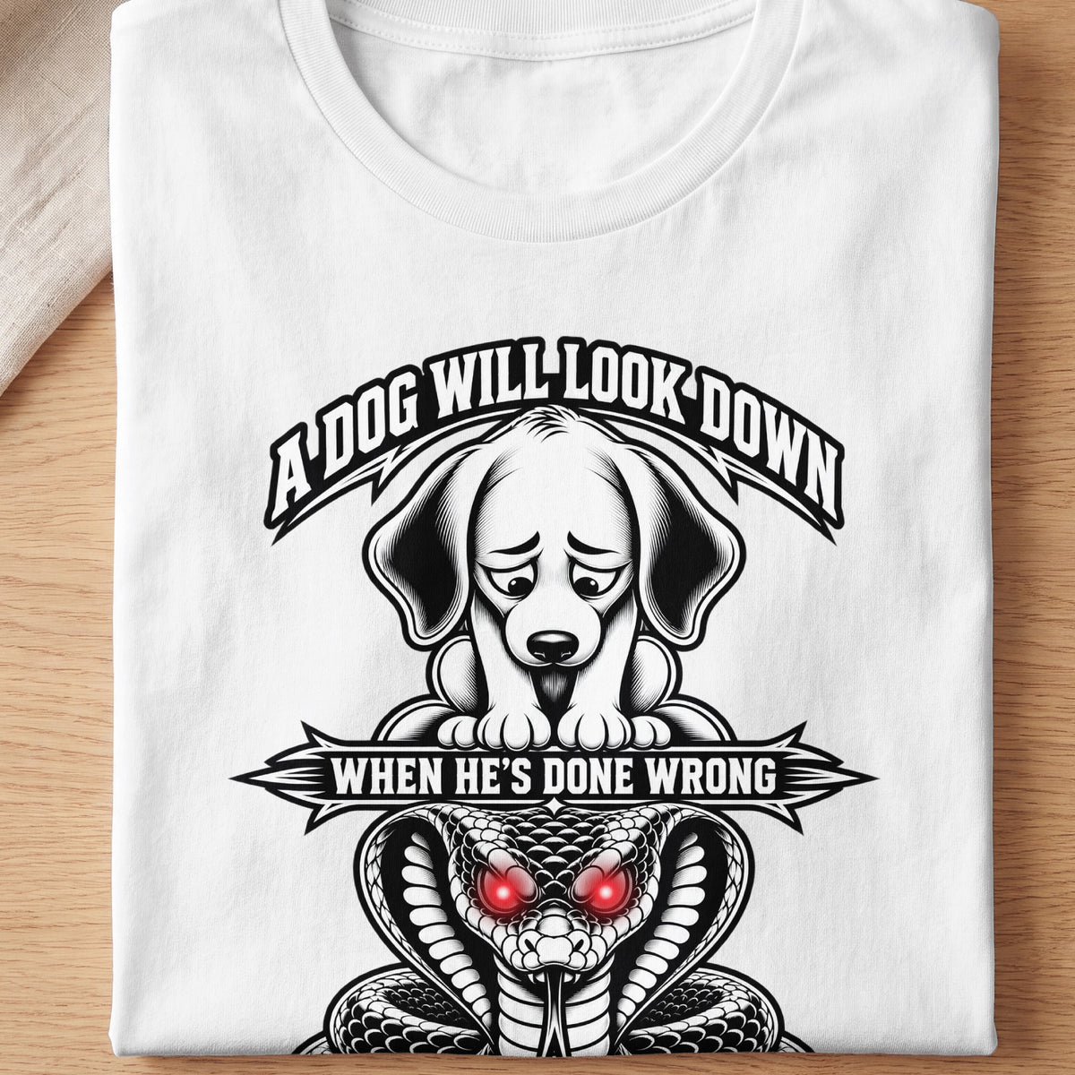 White t-shirt with illustration of sad dog above a cobra with red eyes and text.