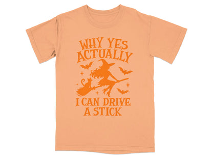 Peach t-shirt with orange graphic: "Why Yes Actually I Can Drive A Stick".