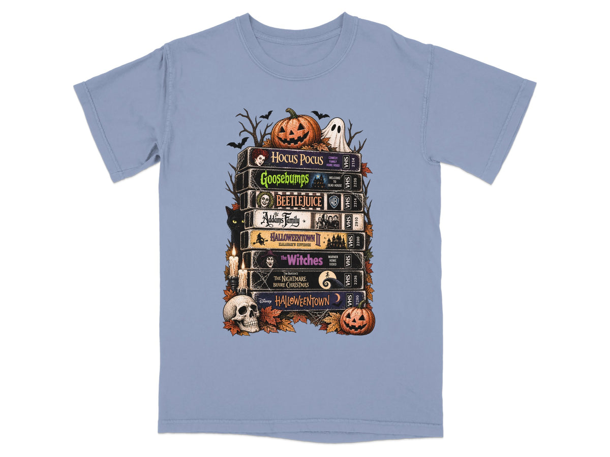 Stack of Halloween movie VHS tapes with pumpkins, ghost, and black cat.