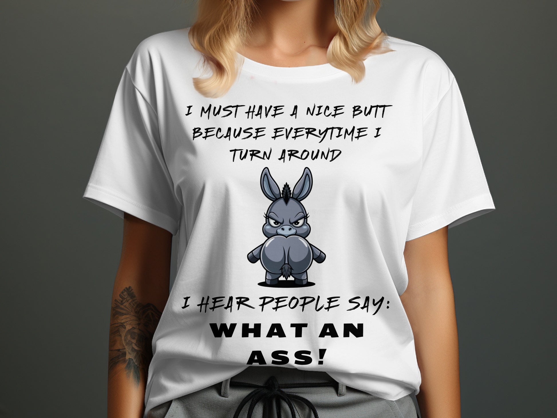 White t-shirt with cartoon donkey graphic and text about a nice butt.