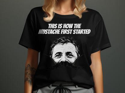 Black t-shirt with "This is How the Mustache First Started" and a man's face with a large mustache.