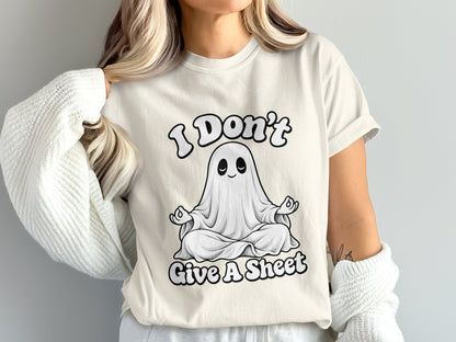 Cream t-shirt with a ghost meditating and the text "I Don't Give A Sheet".