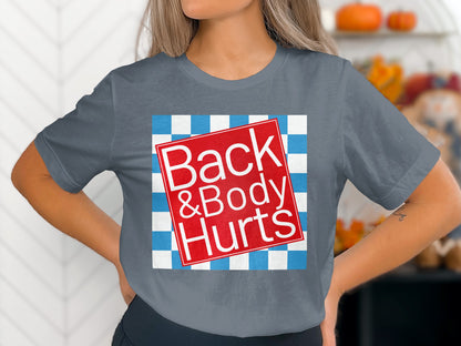 Gray t-shirt with a red square containing white text that says "Back & Body Hurts".