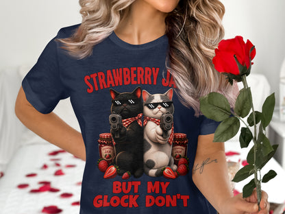 T-shirt graphic with two cats in sunglasses holding guns, with strawberries and jam jars.