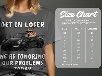 T-shirt with cat wearing sunglasses in a car, text "GET IN LOSER", "WE'RE IGNORING OUR PROBLEMS TODAY", and a size chart.