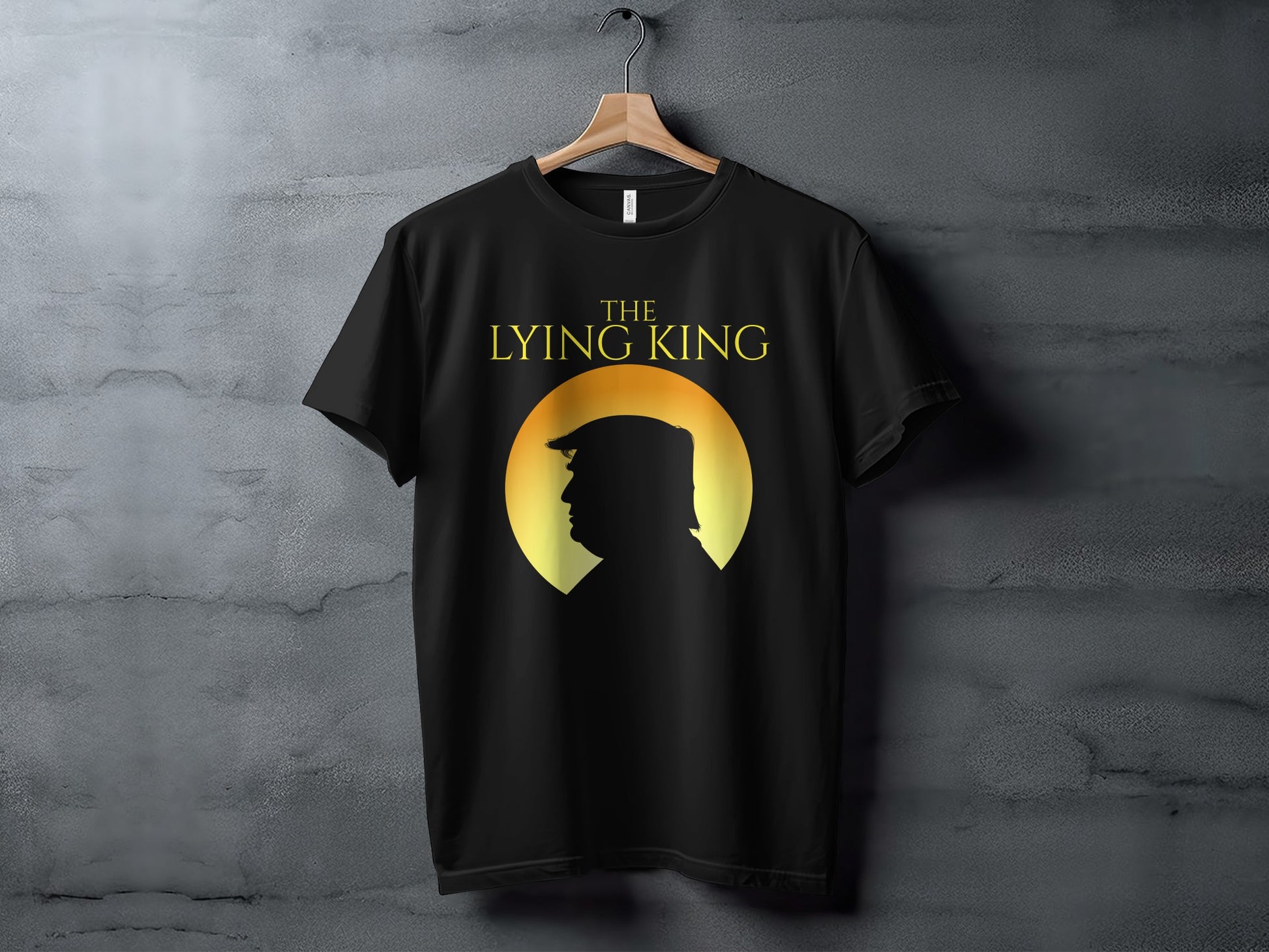 Black t-shirt with yellow text "THE LYING KING" and silhouette of a man's profile.