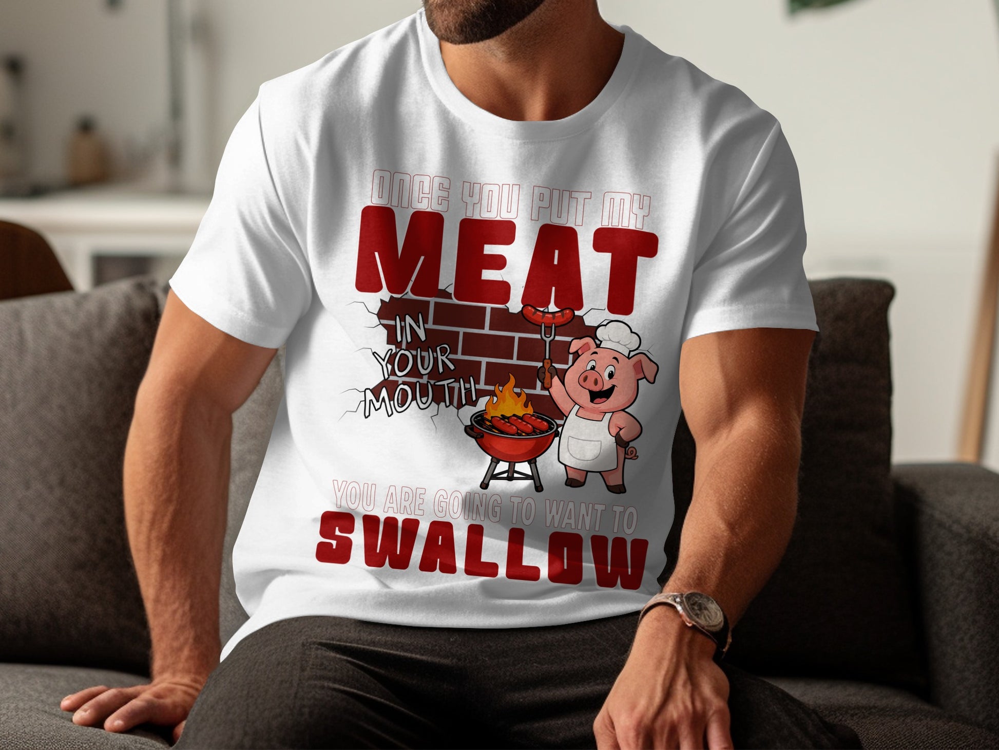 White t-shirt with pig character grilling sausages and text "Once you put my meat in your mouth you are going to want to swallow."