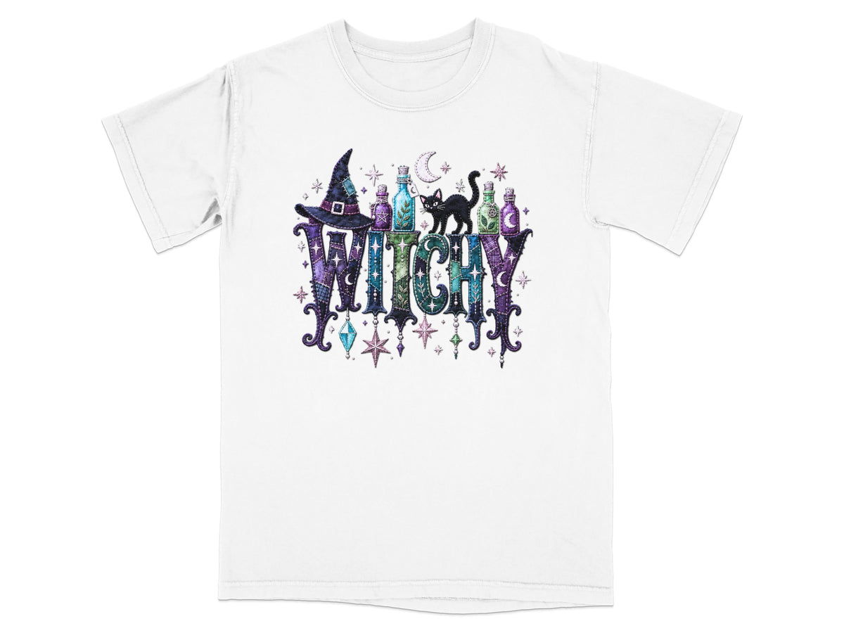 White t-shirt with "WITCHY" text, witch hat, potion bottles, black cat, and stars.