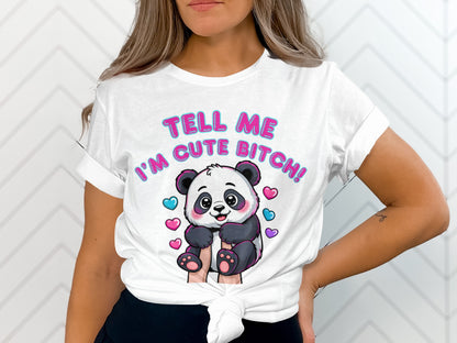 White t-shirt with a cartoon panda and hearts, says "TELL ME I'M CUTE BITCH!".