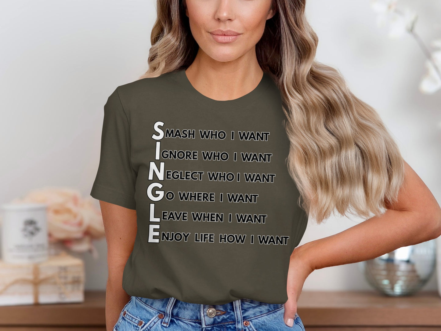 T-shirt with text "SINGLE" forming an acronym of phrases about independence.