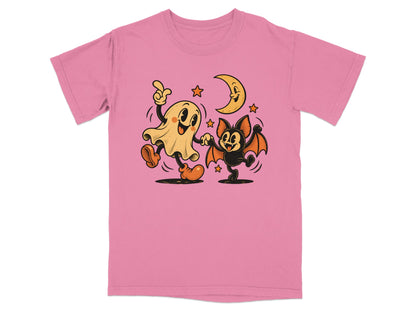 Cartoon ghost and bat dancing under a crescent moon and stars.