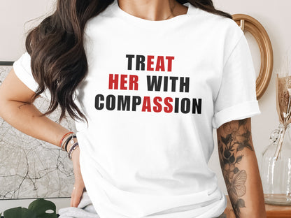 White t-shirt with black and red text "TREAT HER WITH COMPASSION".