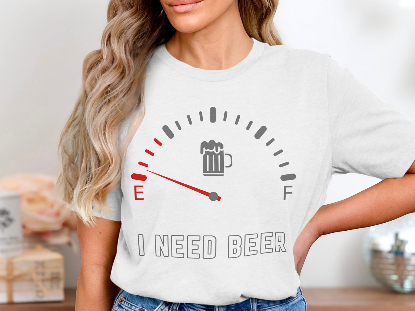 White t-shirt with a fuel gauge graphic and "I NEED BEER" text.