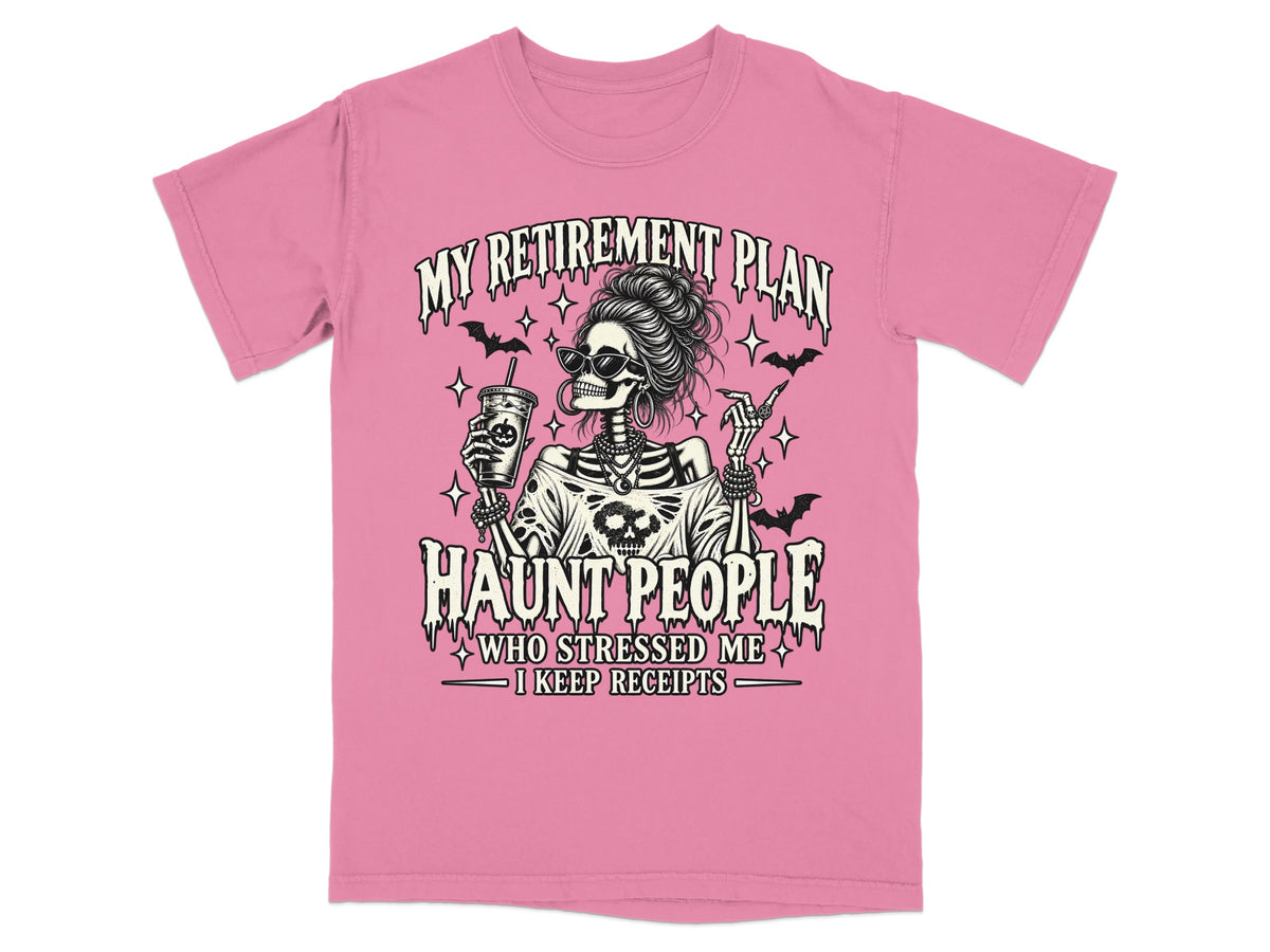 Pink t-shirt with skeleton graphic saying "My Retirement Plan Haunt People".