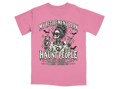 Pink t-shirt with skeleton graphic saying "My Retirement Plan Haunt People".