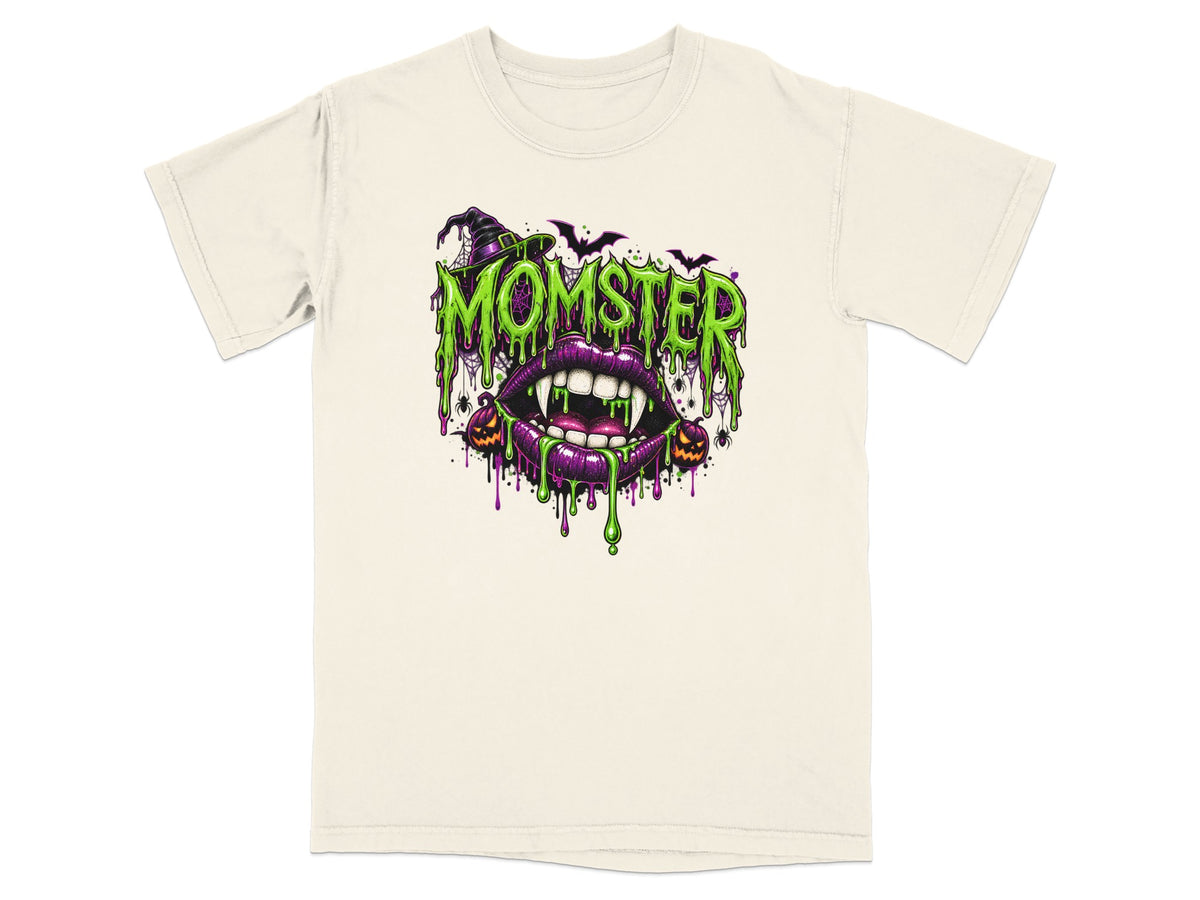 Halloween t-shirt design with "Momster" text, vampire lips, witch hat, and pumpkins.