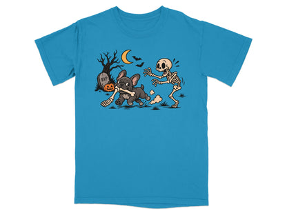 French bulldog with bone chased by skeleton in spooky Halloween scene.