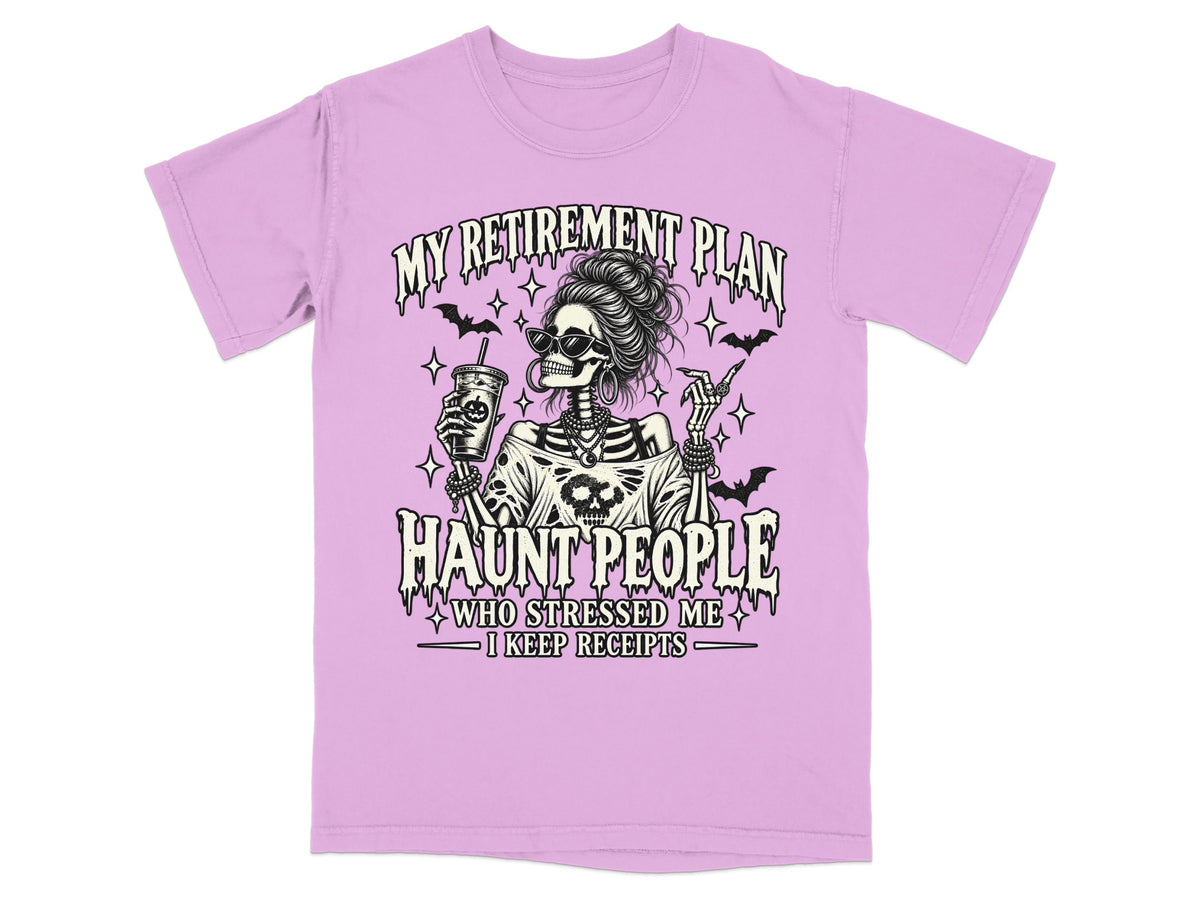 Lilac t-shirt with skeleton graphic and text: "My Retirement Plan Haunt People Who Stressed Me I Keep Receipts."