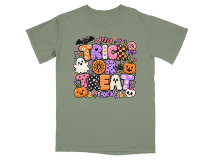 Green t-shirt with "Trick or Treat" text and Halloween graphics.