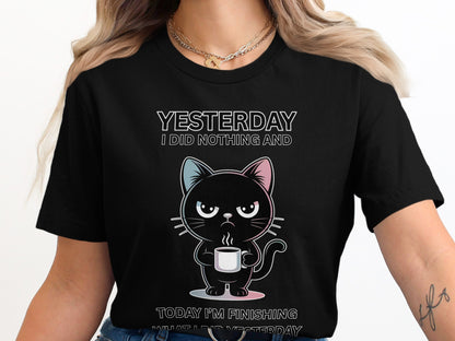 Black t-shirt with cartoon cat holding a coffee mug and text.