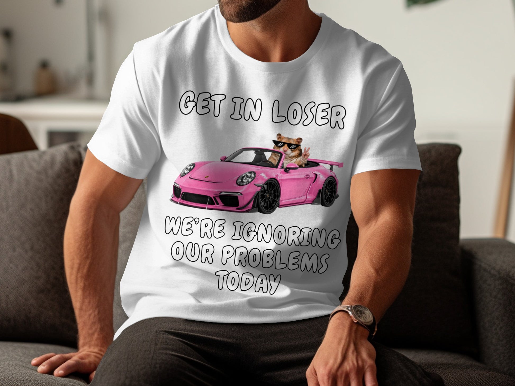 White t-shirt with "Get in loser" and a hamster in a pink car.