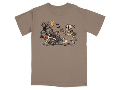 T-shirt graphic of French Bulldog stealing bone from skeleton with tombstone and pumpkin.
